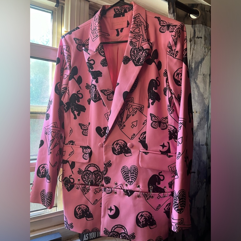 Very detailed blazer with silver safety pins